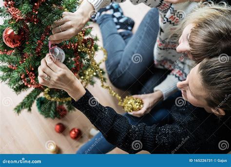 Lesbian Couple Decorating Christmas Tree Stock Image Image Of Bell Inside 165226731