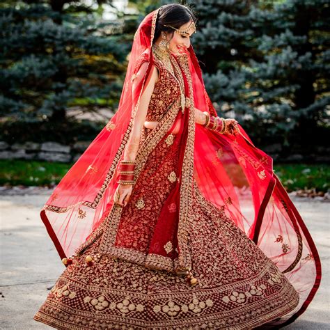 Why Do Indian Brides Wear Red Best Indian Wedding Dresses Indian Bride Indian Wedding Dress