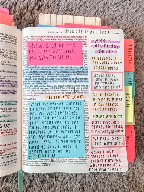 An Open Bible With Sticky Notes Attached To The Pages And Colored