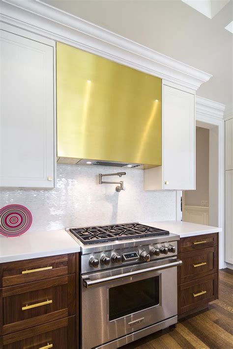 See more ideas about stainless steel kitchen shelves, stainless steel enter the ez off jar opener. Modern spacious kitchen, brass range hood and cabinetry ...