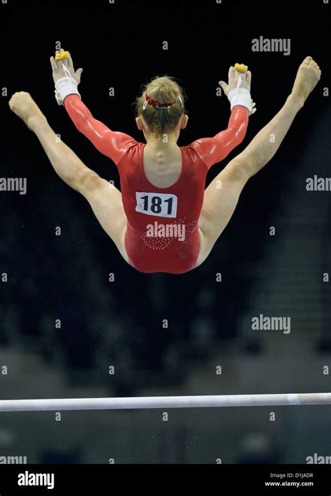 A Female Gymnast Performs A Release And Catch Move On The Uneven Bars During The British