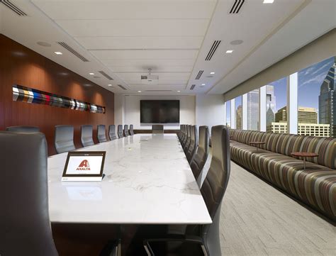 Main Boardroom With Overflow Banquette Seating And A Custom Art