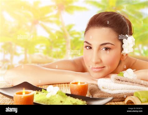 Closeup Portrait Of Cute Brunet Girl Lying Down On Massage Table Outdoors Tropical Beach