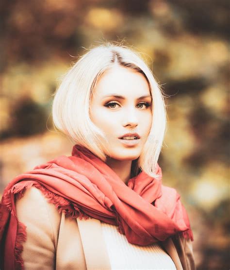 Portrait Of Beautiful Young Woman Walking Outdoors In Autumn Fashion