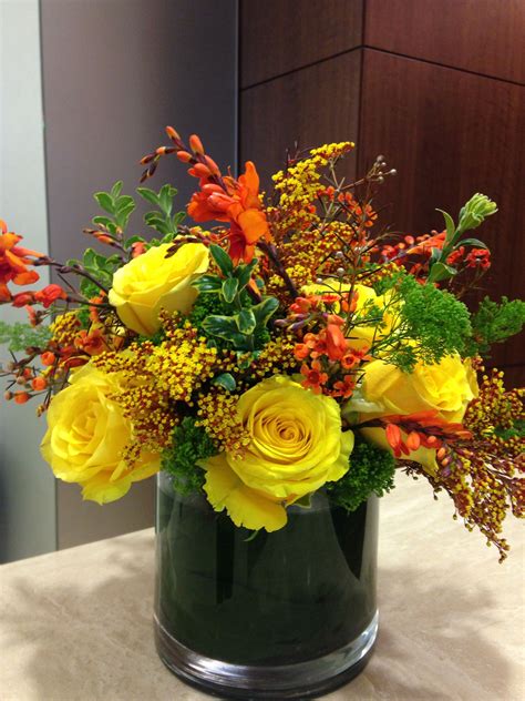 Fall Yellow And Orange Centerpiece By Wedding And Event Florist Kingdom