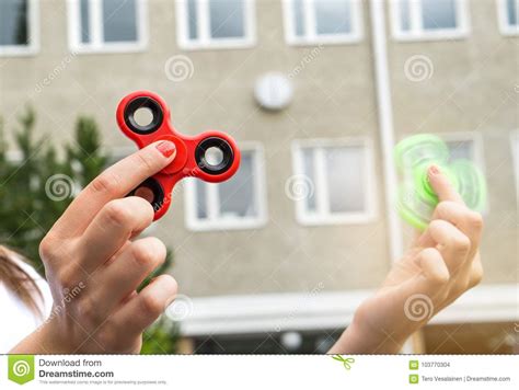 Teenage Girl Playing With Two Fidget Spinner Stock Photo Image Of Light Lifestyle
