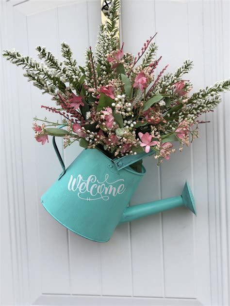 Spring Wreath Made From A Watering Can Flower Stems And Vinyl Diy Spring Crafts Paper