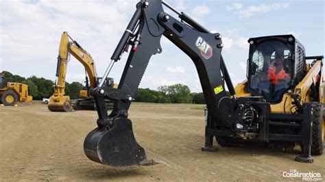 Caterpillars Smart Backhoe Attachment Gives Skid Steers A Full