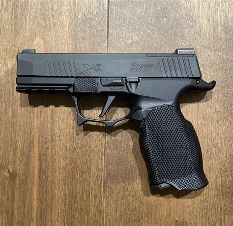 P365XL with Icarus Precision XL Evo grip. : r/SigSauer