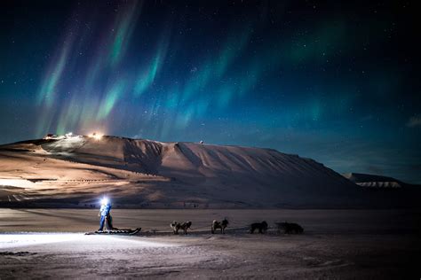 See The Northern Lights On Eco Friendly Electric Snowmobiles In Svalbard