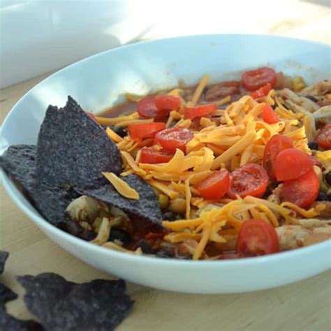 Just make a big pot of it in your slow cooker and have a topping bar with sour cream, cheese, avocado, chips, or whatever else your favorite toppings for tacos might be. Crock Pot Chicken Taco Soup Recipe: Easy Dinner Idea