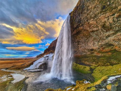 Visiting Seljalandsfoss Waterfall In Iceland