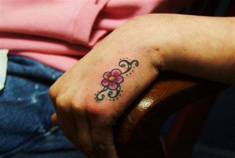 40 Small Hand Tattoo Designs That Will Make You Want One Flower