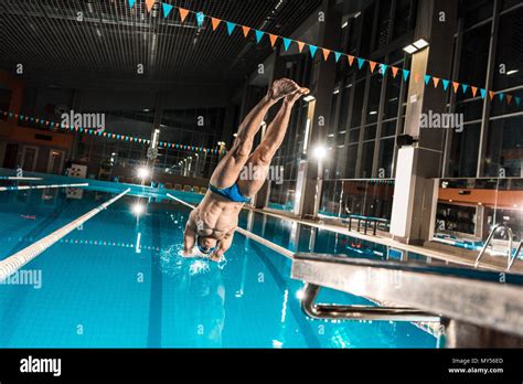 Swimmer Diving In Competition Swimming Pool Stock Photo Alamy