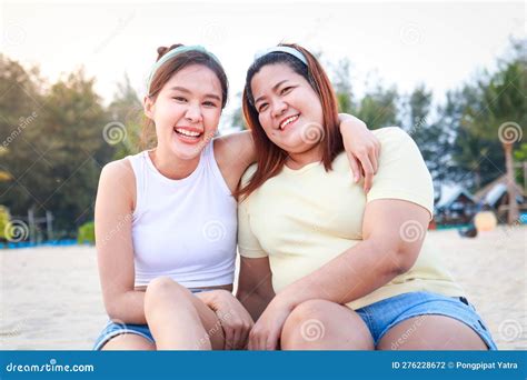 Two Fat And Skinny Asian Girls Having Fun Enjoying Sea Tourism Sitting