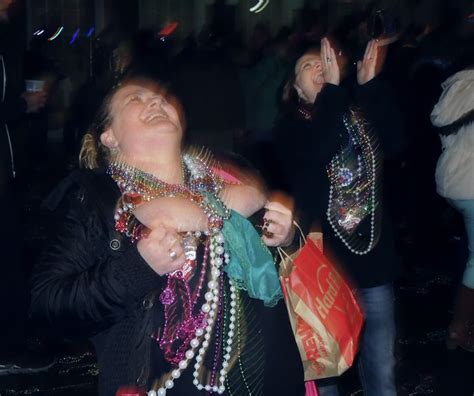 A Women Shows Her To Get Beads During A Night On Bourbon Street In