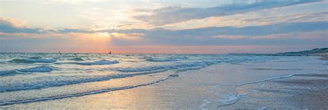 Sea Along A Sandy Beach In The Light Of Sunset Stock Image Image Of