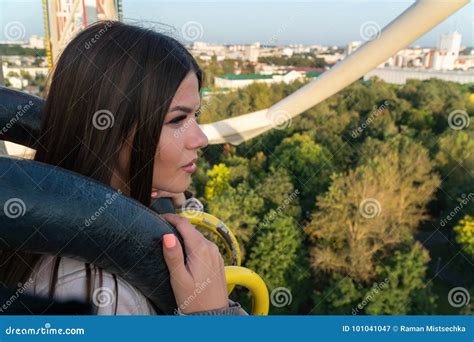 a girl is riding a ferris wheel stock image image of blue artistic 101041047