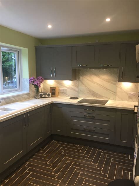It's important to remember that this won't just look good. Howdens kitchen Fairford grey with white marble effect ...