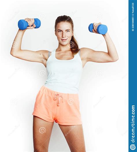 Young Pretty Slim Blond Woman With Dumbbell Isolated Cheerful Smiling Measuring Herself Diet