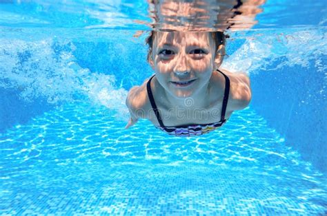 Happy Active Underwater Child Swims In Pool Stock Photo Image Of
