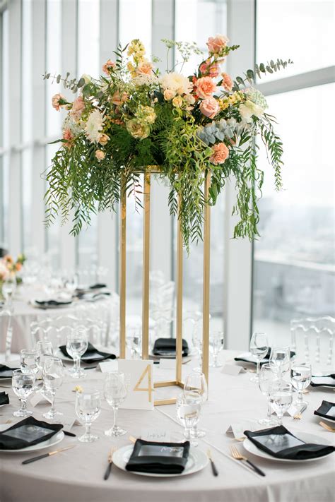 Round Tables With Elegant Tall Centerpieces Tall Wedding Centerpieces