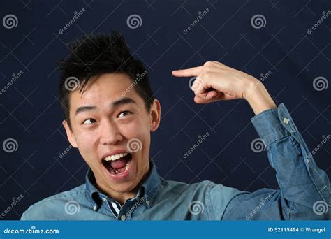Funny Young Asian Man Pointing The Index Finger At Haircut Stock Photo