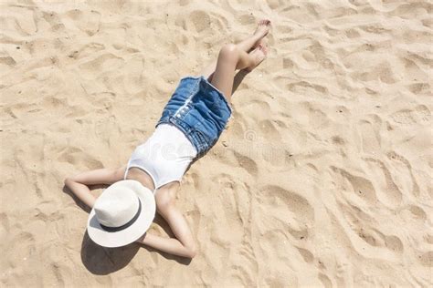A Woman Is Laying On The Beach Stock Image Image Of Rest Coastline 189316797