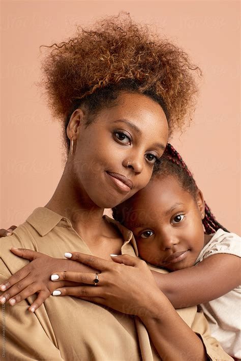 Little Black Girl Hugging Her Elder Sister By Stocksy Contributor Clique Images Stocksy