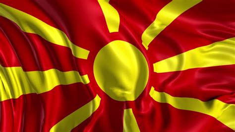 The national flag of macedonia consists of stylized yellow sun centered on red field with its eight broadening yellow rays extending out in all directions and end at the edges of the flag. Flag of Macedonia Beautiful 3d Stock Footage Video (100% ...