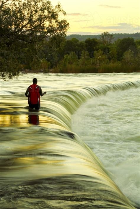 Image Of A Solitary Man Uses A Hand Line Fishing For Barramundi At