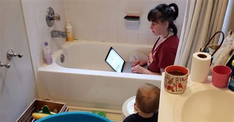 Photo Of Mom Working In A Bathtub During Pandemic Goes Viral Motherhood Isnt A Favor
