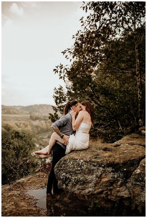 kissing on cliffs and waterfall frolics in this epic engagement shoot lesbian engagement