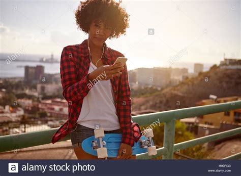 Girl Wearing Blue Jeans And White Shirt Fotos Und Bildmaterial In