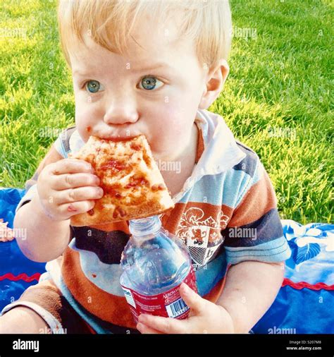 Baby Eating Pizza Stock Photo Alamy