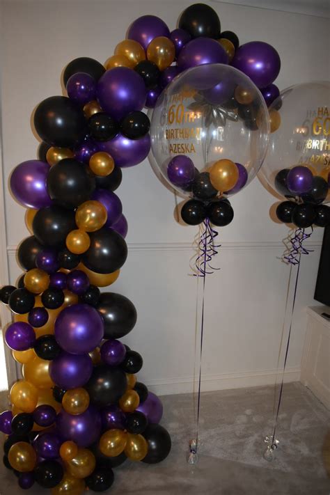 Balloons And Streamers Are Arranged In The Shape Of A Tower