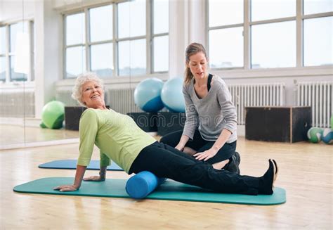 Senior Woman Doing Pilates With Foam Roller Stock Image Image Of