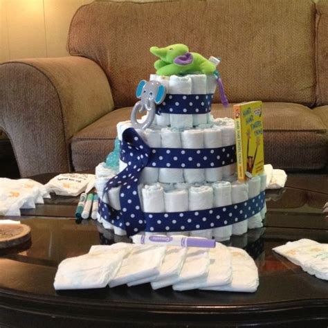 And encouraged everyone to write either a cute, funny or inspirational diaper message. My friend, Cari, and I made our own diaper cake for a baby ...