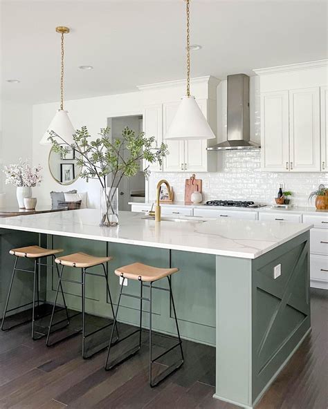 This White Kitchen Boasts A Contrasting Muted Green Kitchen Island With