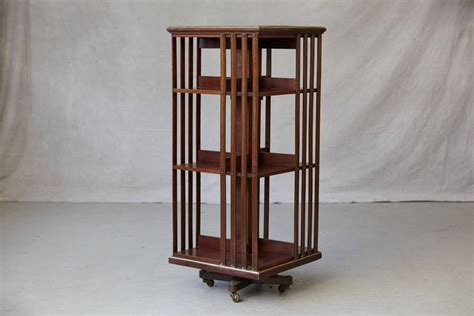 Antique French Revolving Mahogany Bookcase On Raised Casters With Brass