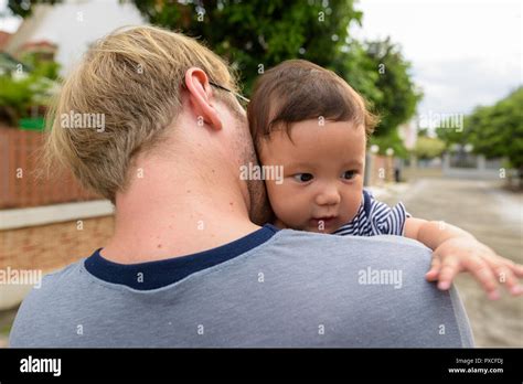 Father And Baby Son Bonding Together At Home Outdoors Stock Photo Alamy