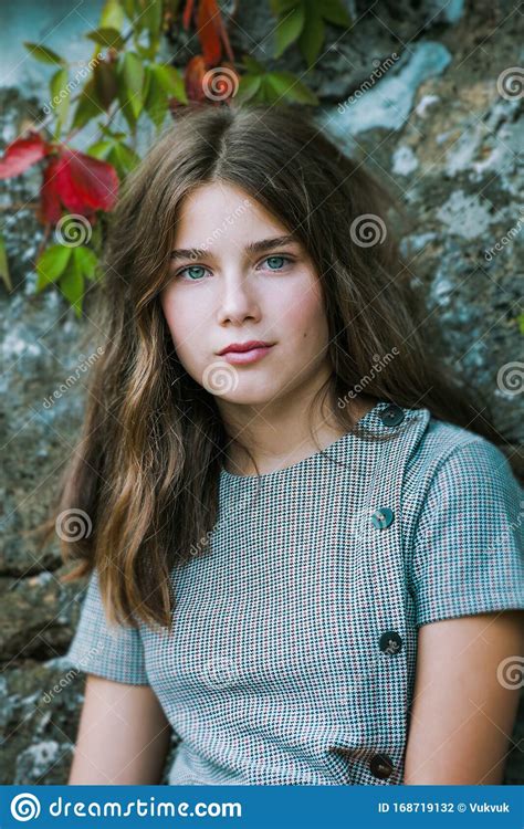 Blue Eyes Teen Girl Portrait Outdoor Shot Against Stone Wall Closeup