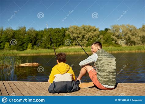 Happy Smiling Father And Son Fishing On River Stock Image Image Of