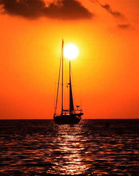Sail Boat Anchored At Sunset Sailing Boat Beautiful Sunset