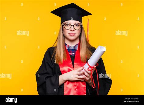 Girl Graduate In Graduation Hat And Eyewear With Diploma On Yellow