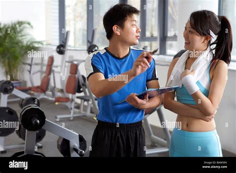 Personal Trainer Instructing Female Hi Res Stock Photography And Images
