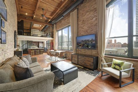 Bored with traditional ceiling light? Modern loft with exposed brick, exposed ductwork, exposed ...