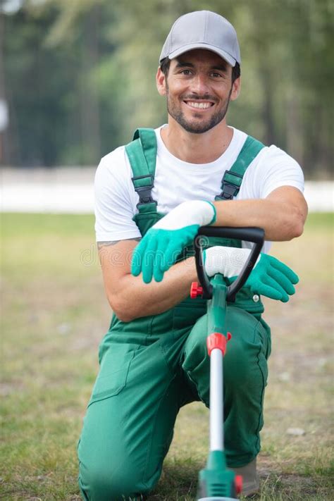 Handsome Male Gardener Posing Holding Grass Trimmer Stock Photo Image