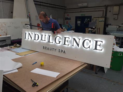 led illuminated sign in the workshop shop signage retail signage wayfinding signage signage