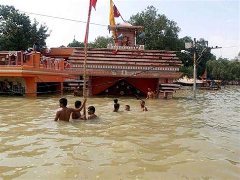 Uttar Pradesh Floods Overflowing Ganga Submerges Temples Houses In